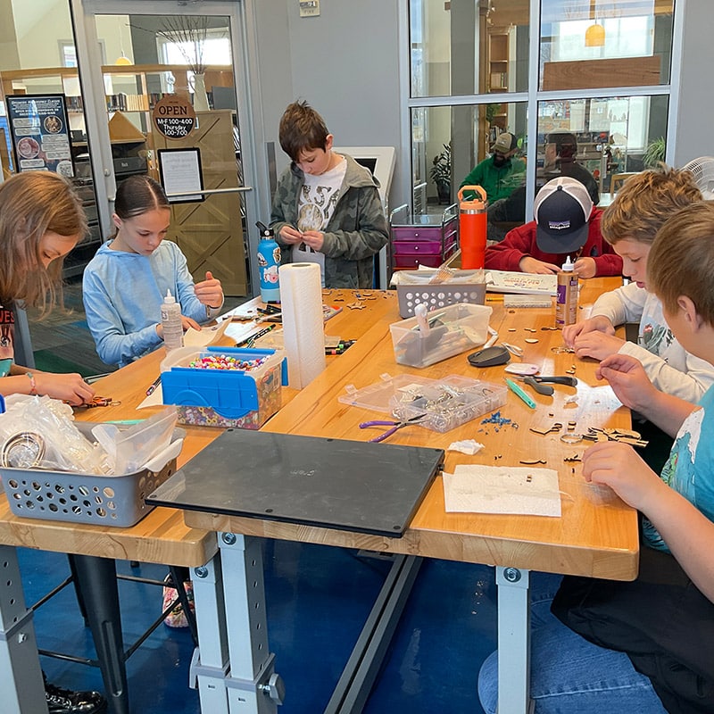 Creating bead crafts at the Glenn A Jones MD Memorial Library Teen Programs