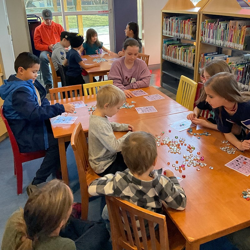 Group of teens playing table games at the Glenn A Jones MD Memorial Library Tween Programs